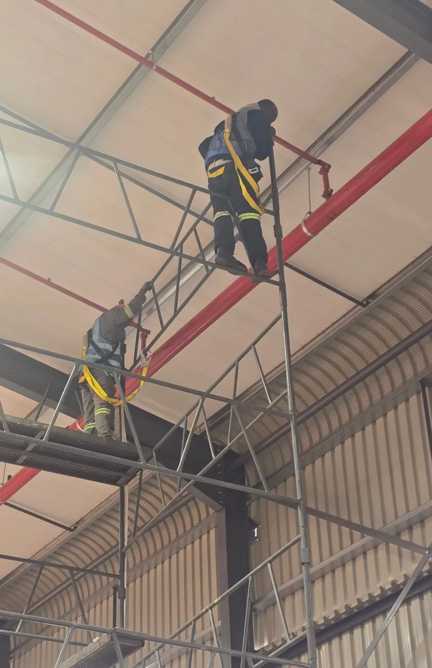 Installing a fire main from scaffolding