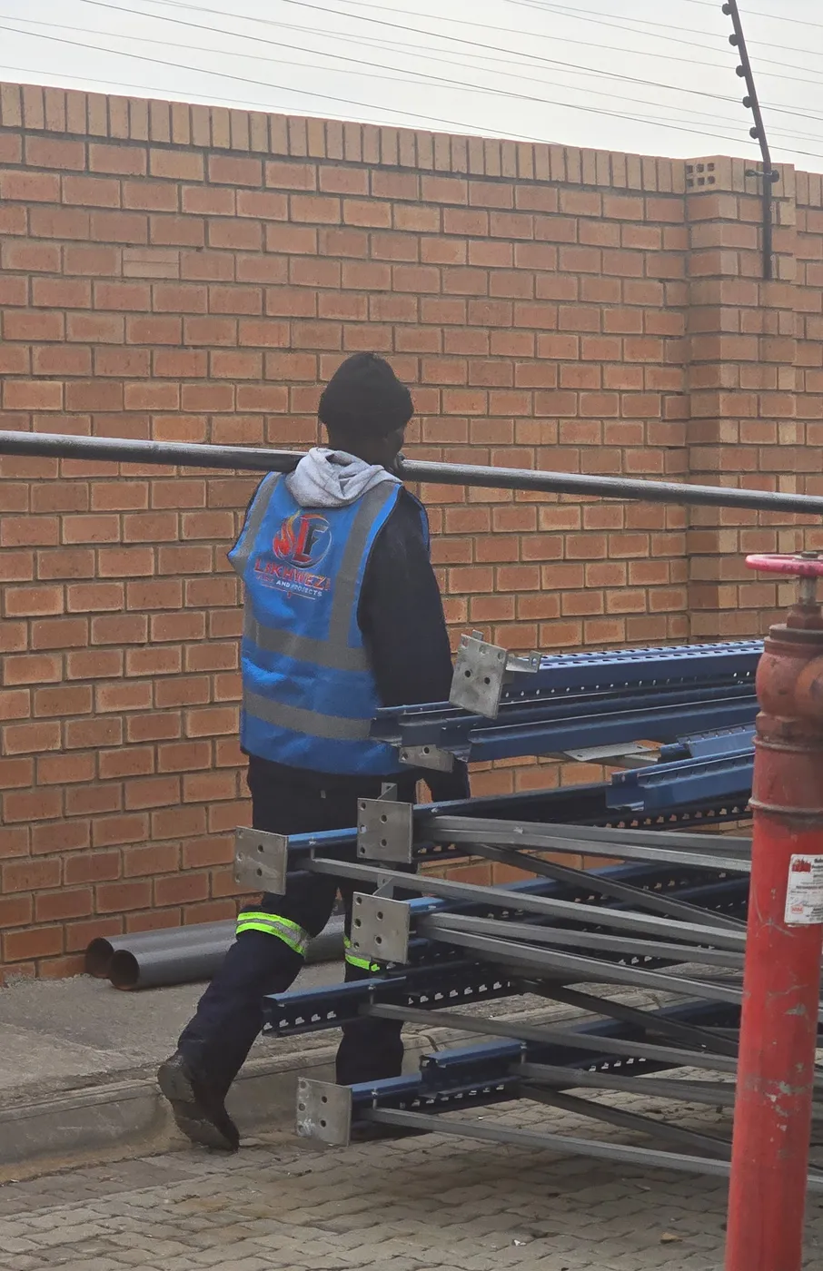 Likhwezi team assembling structural steel racking